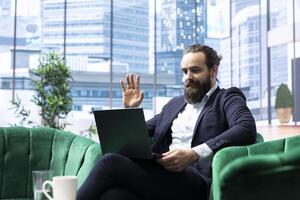 Successful male entrepreneur meeting online with his experts team, focusing on problem solving, decision making and achieving strategic objectives. Productivity for a success story. photo