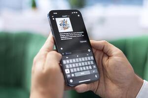 Bucharest, Romania - July 30th 2024 - AI driven chatGPT on a mobile app assisting a business leader with tasks, exemplifying digital innovation. Efficient machine learning tools. photo