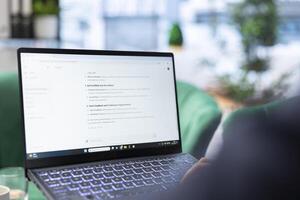 Bucharest, Romania - July 30th 2024 - Manager writes prompt on AI chatbot system to automate workflow at corporate office. Leader uses the chat GPT virtual web assistant for smart automation. photo