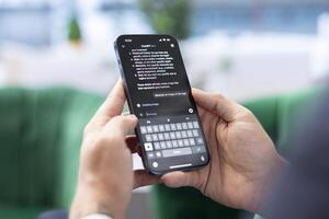 Bucharest, Romania - July 30th 2024 - Boss uses the AI virtual assistant via mobile phone app, using artificial intelligence to provide real time solutions. Efficient data analysis bot. photo