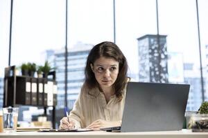 Entrepreneur with authority and executive power signing work contracts, solving her daily tasks of authorizing different requests from department employees. Jurisprudence paperwork. photo