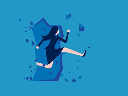 businesswoman running through a broken wall