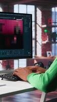 Vertical African American IT expert using AI technology to generate realistic images from text prompts. Young adult engaging with artificial intelligence tools online, text to image. Camera B. video