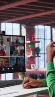Vertical Manager talking to employees during web call at home, analyzing business documents, organizing job tasks. Supervisor doing remote teleconference meeting with staff members. Camera B. video