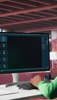 Vertical Black male freelancer at home uses AI chatbot for task completion, automation and machine learning. Young adult uses artificial intelligence to generate new ideas with prompts. Camera B. video