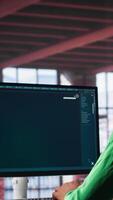 Vertical Digital editor uses AI powered text to generator to create content, listening to music on headset. Internet connectivity and artificial intelligence tools on high tech software. Camera A. video