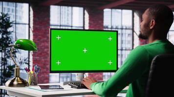 Man at home using mockup on pc preparing presentation slides, adjusting layouts for an assignment. Employee finishing company project, saving files and uploading materials. Camera A. video