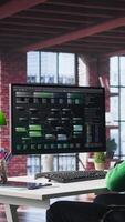 Vertical African american engineer at home working on visual coding on terminal window, typing programming language and reviewing the notes tree. IT expert using debugging algorithms to fix errors. Camera B. video