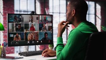 Manager talking to employees during web call at home, analyzing business documents, organizing job tasks. Supervisor doing remote teleconference meeting with staff members. Camera A. video