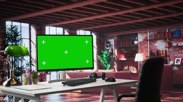 Luxurious apartment workspace with chroma key screen on a clean empty desk. Spacious interior features wood and glass elements, creating a refined and cozy ambiance with artistic flair. video