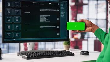 Young man using AI chatbot to generate real time responses next to mockup display, power of artificial intelligence. Smart automation simplifying online communication and problem solving. Camera A. video