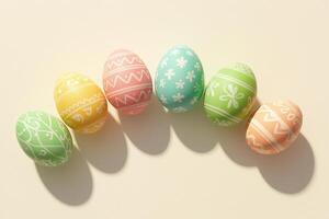 Pastel decorated easter eggs with white patterns arranged in minimal spring flatlay on light background for cheerful holiday celebration and modern festive style concept photo