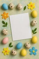 Festive invitation mockup with colorful eggs, flowers, and green leaves against a textured background, featuring a white blank card. photo