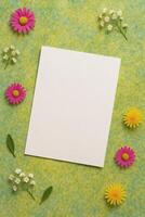 Floral Card. A blank white card surrounded by colorful flowers and foliage, perfect for invitations or personal notes, flat lay design. photo