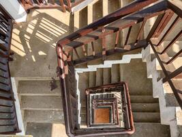 Top-Down View of a Spiral Staircase Inside a Bird-Watching Tower. photo