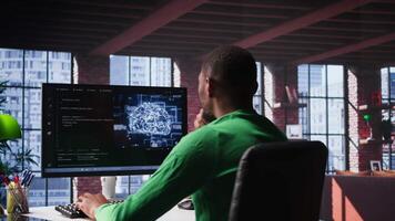 Black tech engineer programming an AI brain neural network for machine learning, doing maintenance and debugging the software systems. Technician expert uses coding language. Camera B. video