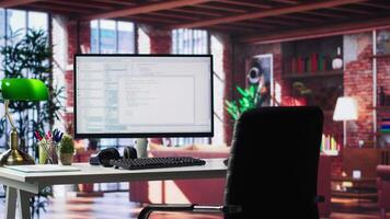 Modern loft with desktop monitor ready for coding and programming tasks, spacious workspace . Perfect environment for developing secure applications and online software systems. video