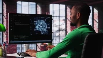 System administrator programming AI brain computerized model of neural network for machine learning, solving tasks on computer. Debugging software algorithm and checking for errors. Camera A. video