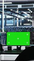 Vertical Mockup PCs in data center control hardware energy usage using node tree tech interfaces. Isolated screen workstations automate and supervise operations in server farm using visual programming video