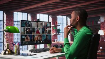 Manager talking to employees during web call at home, analyzing business documents, organizing job tasks. Supervisor doing remote teleconference meeting with staff members. Camera B. video