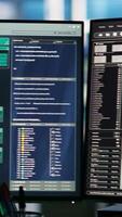 Vertical Data center computer systems controlling network resources through AI visualization dashboards and node tree programming software that maps infrastructure connections, close up shot video