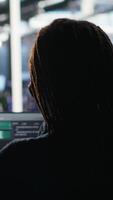 Vertical Data center engineer implements AI virtualization frameworks to optimize server clusters. Server hub IT professional doing artificial intelligence predictive analysis, camera B video