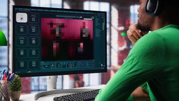 African american user operates program to create digital photos in modern loft. Man explores creative visualization with artificial intelligence tools, with prompts. Camera A. video