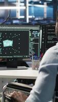 Vertical Overworked man in wheelchair upset by error warning popup while looking at server hub AI analytics metrics. Data center worker with disability irked by malfunction while using node tree tool, camera B video