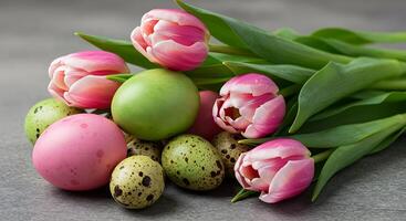 Pink Tulips with Colorful Easter Eggs on Gray Background Close-up photo