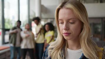Caucasian girl suffering with lonely stressed woman girl student grief in university high school college bullying by multiracial students diversity classmates bully mock up education problem mockery video
