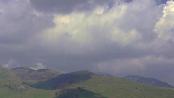 Timelapse of Wind Driven Clouds Over Scenic Mountains video