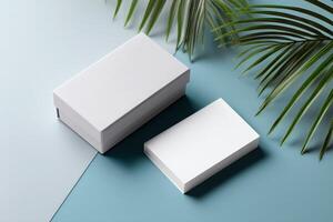 Branded packaging boxes with a thank-you note on a colorful surface with green leaves photo