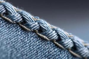 Zigzag stitching detail along a denim seam showcasing textile craftsmanship photo