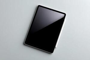 Modern tablet resting on a smooth surface during a quiet workspace moment photo