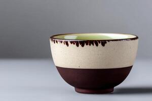 Elegant ceramic tea cup with light glaze showcasing craftsmanship and modern design photo