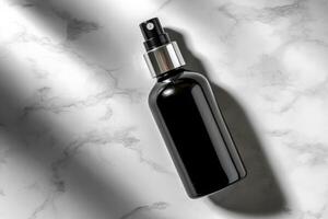Elegant black spray bottle on marble surface showcasing modern packaging design photo