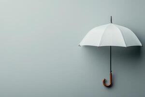White umbrella hanging against a plain gray background showcasing minimalistic design photo