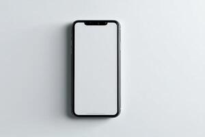 Modern smartphone laying flat on a light surface with an empty screen for design purposes photo