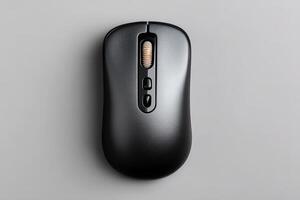 Wireless computer mouse in matte black placed on a smooth surface for easy access and use photo