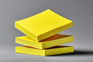 Stack of yellow sticky notes casting realistic shadows on a gray background photo