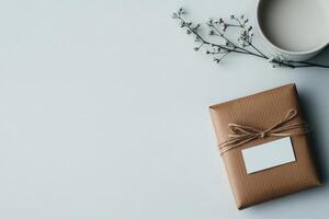 Branded packaging thank you card and wrapped gift on a clean workspace photo