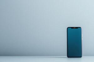 Modern smartphone stands against a minimalist background in a tranquil setting photo