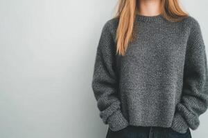 Warm gray sweater worn by a woman in casual setting against light background photo