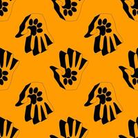 Seamless pattern showing human hands merged with animal paw prints in black on an orange background. Ideal for pet care, adoption, or wildlife support themes and designs. vector