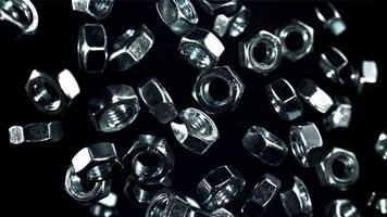 The mounting nuts fly up and fall down. Filmed on a high-speed camera at 1000 fps. High quality FullHD footage video