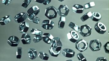 The mounting nuts fly up and fall down. Filmed on a high-speed camera at 1000 fps. High quality FullHD footage video