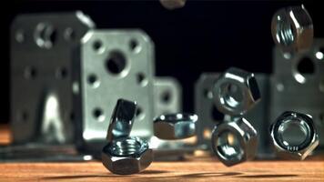 The nuts fall on the wooden surface. Filmed on a high-speed camera at 1000 fps. High quality FullHD footage video