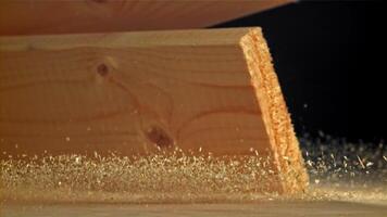 The planks fall on the carpenter's table. Filmed on a high-speed camera at 1000 fps. High quality FullHD footage video