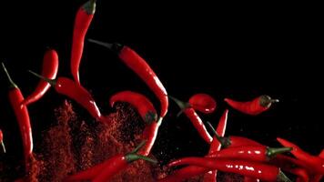 Red chili peppers fly up and fall down. Filmed on a high-speed camera at 1000 fps. High quality FullHD footage video