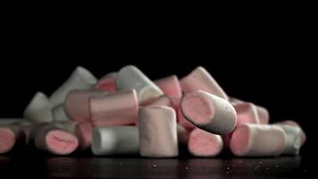 Marshmallows fall on the table. Filmed on a high-speed camera at 1000 fps. High quality FullHD footage video